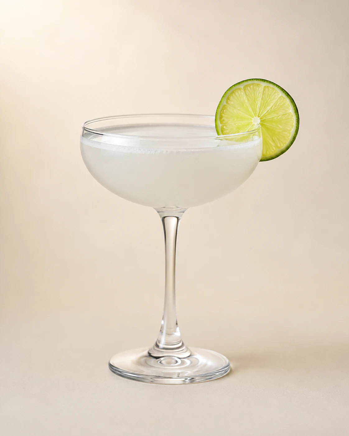 Classic daiquiri in a chilled coupe glass with a lime wheel