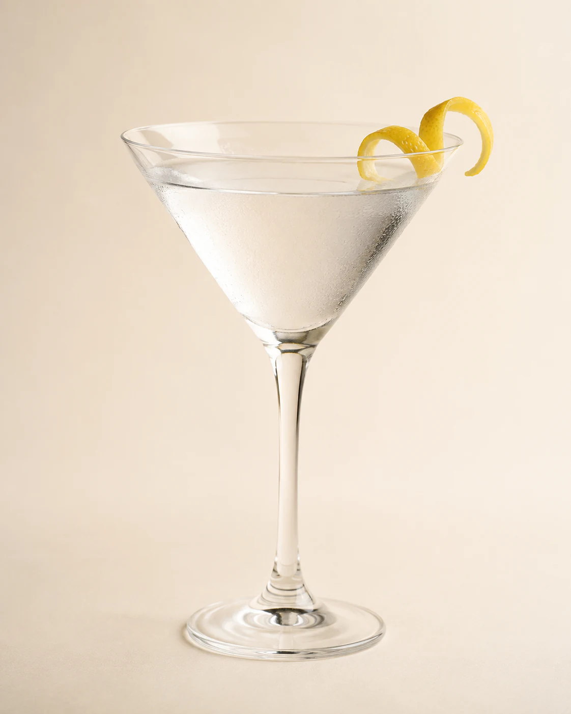 Dry martini in a chilled stemmed glass with a lemon twist